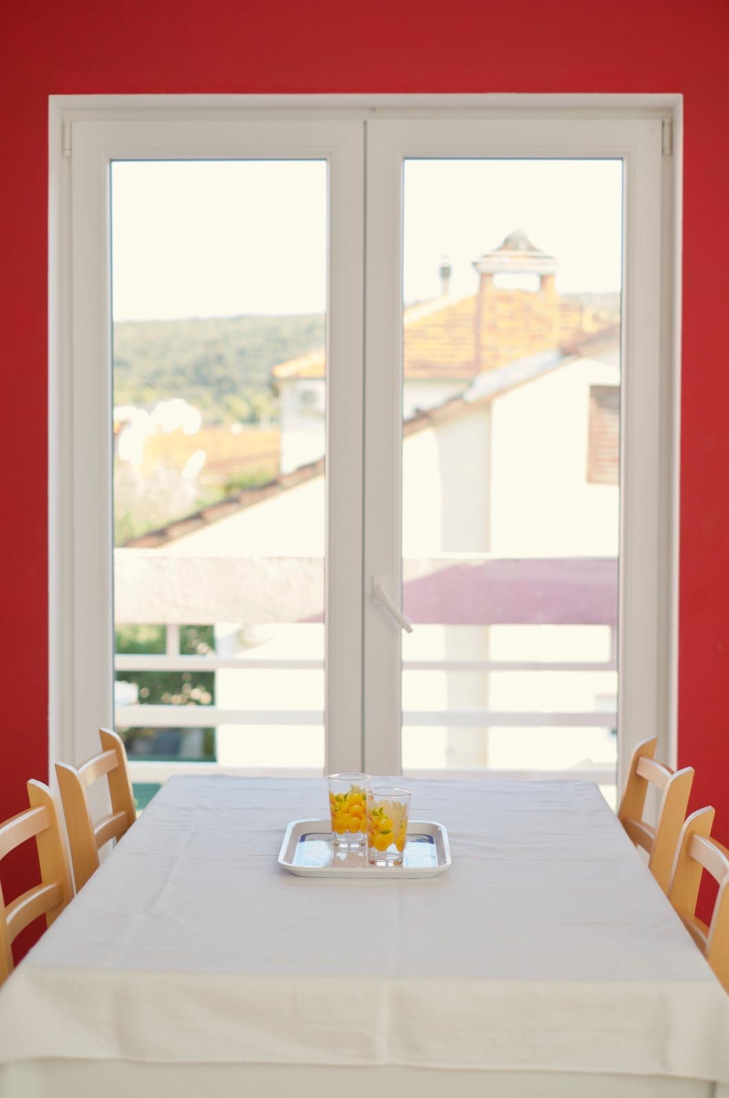 Dining area with balcony view over Vinišće bay, Dalmatia